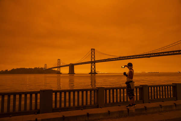 Wildfires turn California skies glowing orange