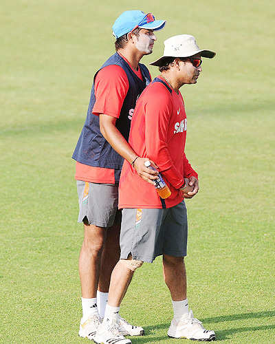 Suresh Raina and Sachin Tendulkar during a training session at The Punjab  Cricket Associaton (PCA) Stadium in Mohali on March 28, 2011. India will  face Pakistan in an ICC Cricket World Cup