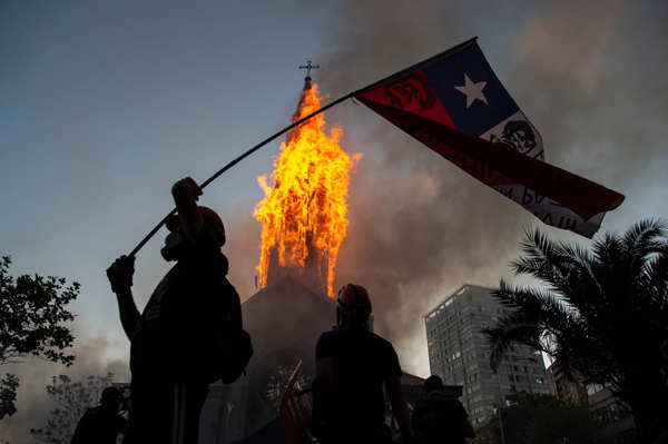 Two churches set ablaze as protests turn violent in Chile