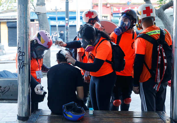 Two churches set ablaze as protests turn violent in Chile