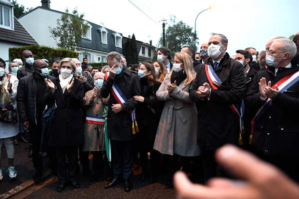 People pay tribute to the history teacher Samuel Paty, who was beheaded ...