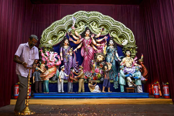 Devotees celebrate Durga Puja with COVID-19 safety protocols