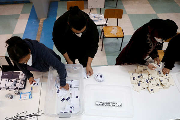 Chileans vote by millions to tear up Pinochet's constitution