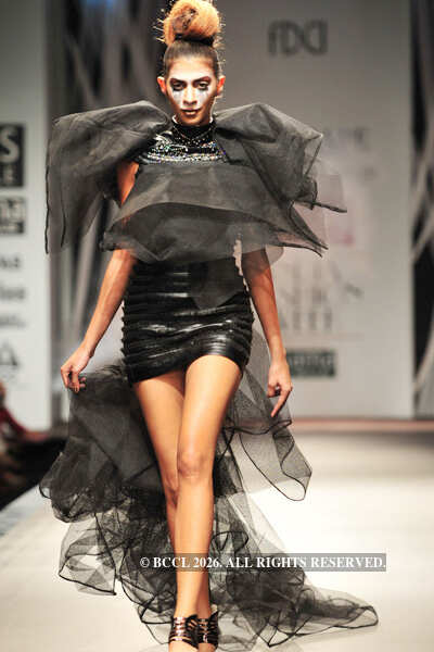 A model showcases a creation by designers Shantanu and Nikhil on Day 3 ...