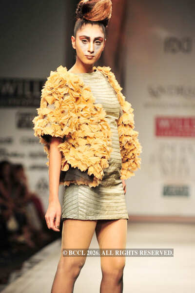 A model showcases a creation by designers Shantanu and Nikhil on Day 3 ...