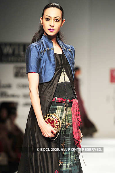 A model showcases a creation by designers Ashish Viral and Vikrant on ...