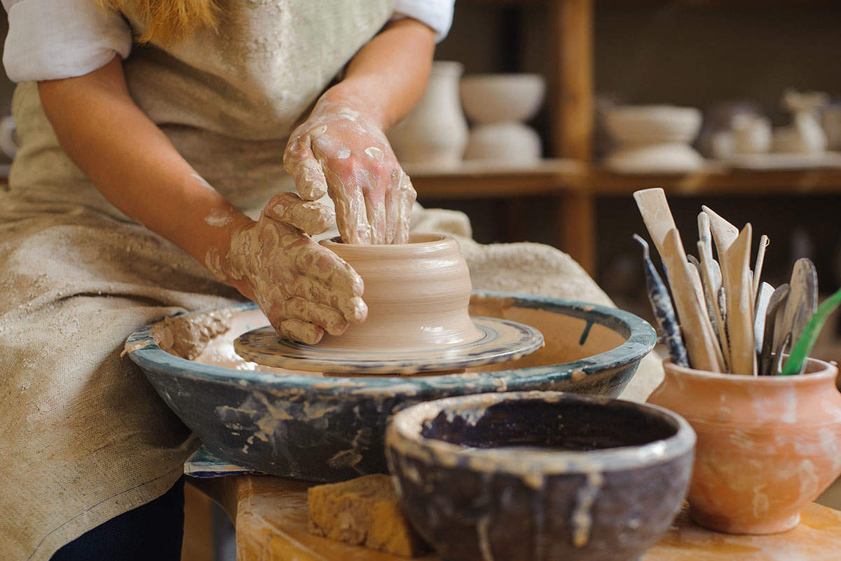 woman-spinning-on-a-pottery-wheel