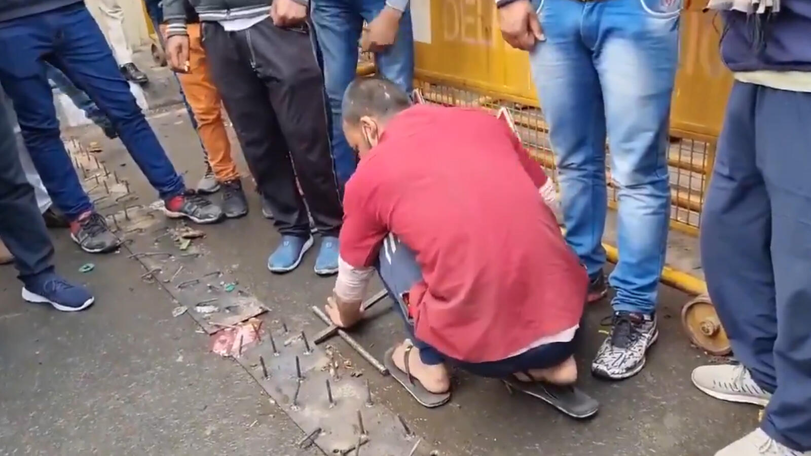 Farmers' protest: Nails studded on road being removed at Ghazipur border