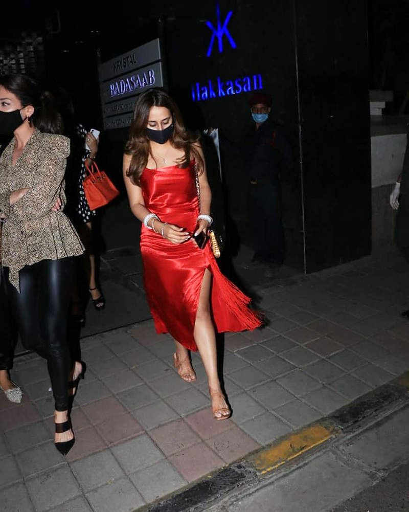 Newly-wed Natasha Dalal is making heads turn in a thigh-high slit dress on dinner outing