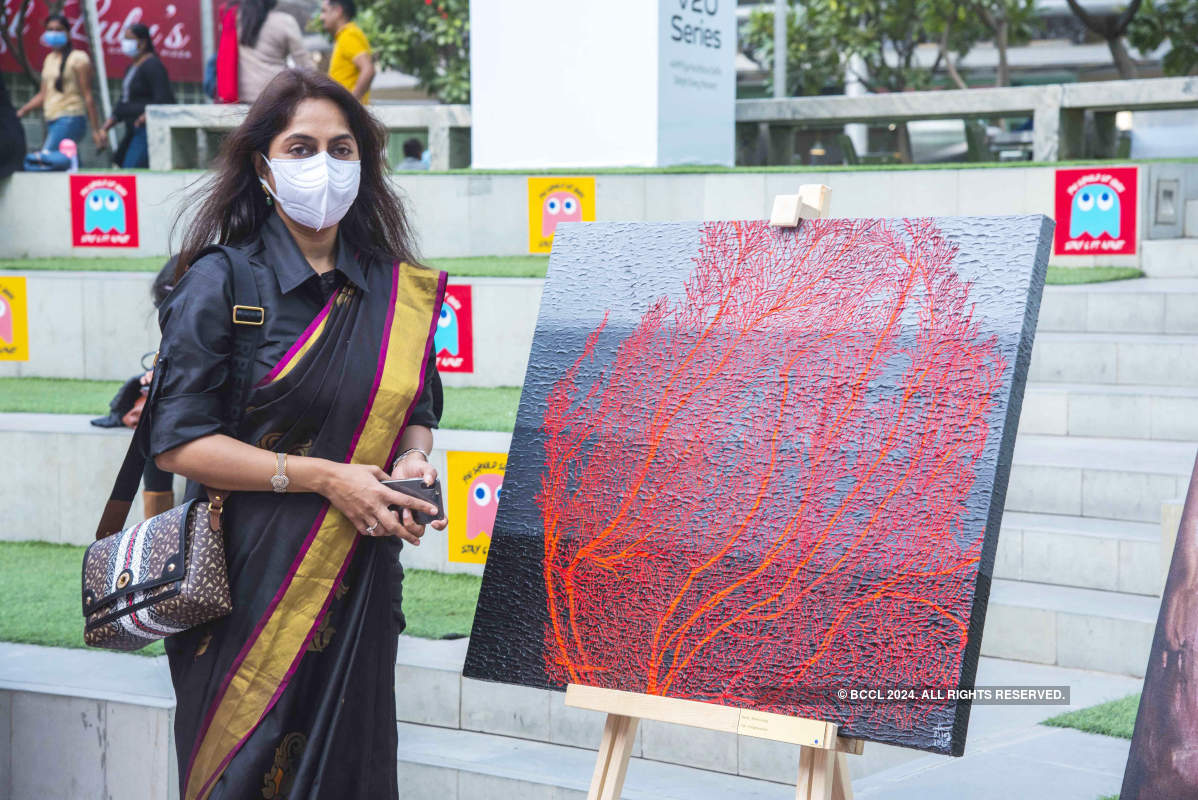 Art lovers attend an exhibition at Cyber Hub