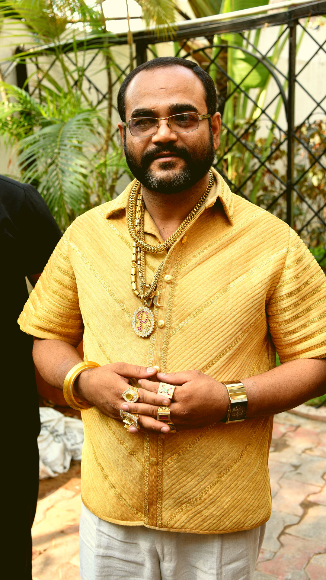 indian with gold shirt