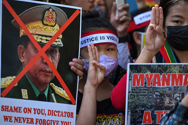 Myanmar refugees hold protest against military coup