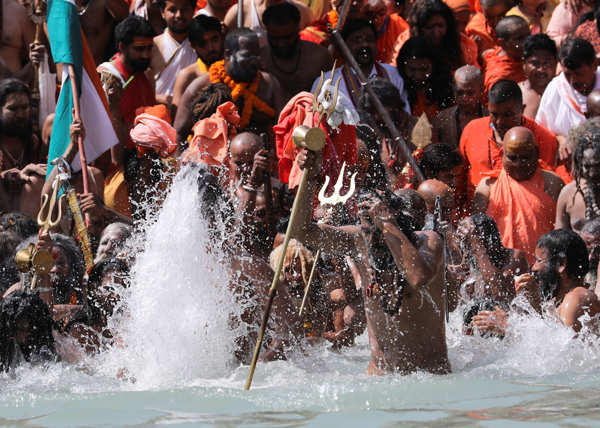 Devotees Take A Dip In The Ganges River During The First Shahi Snan At Kumbh Mela In Haridwar 