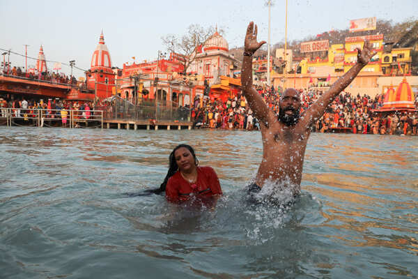 Devotees take a dip in the Ganges river during the first Shahi Snan at Kumbh Mela in Haridwar - Photogallery