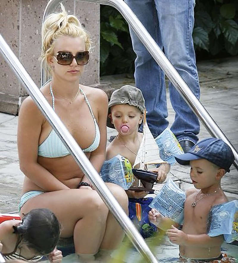 Britney Spears is teasing fans with a throwback pool picture with little kids