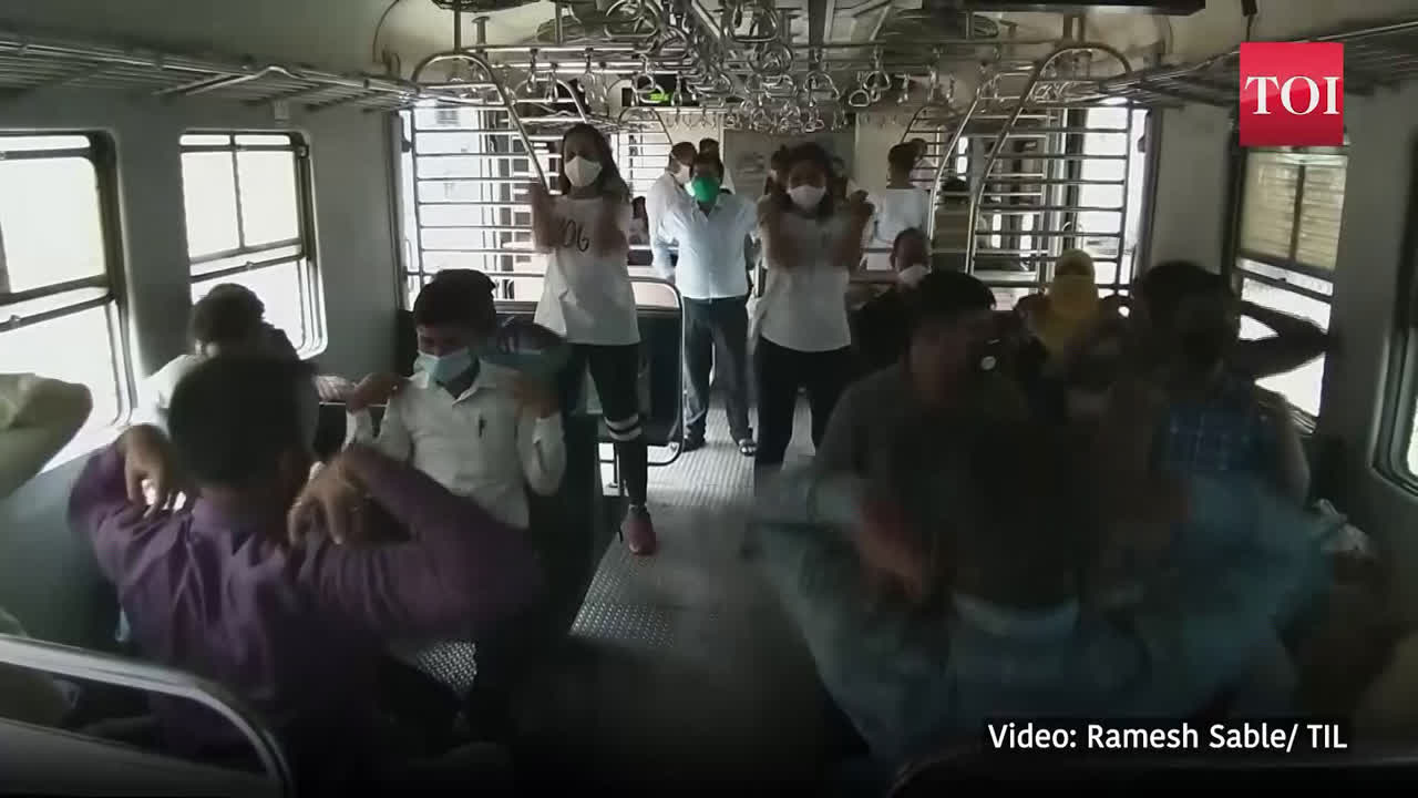 Yoga Day: Local train passengers in Mumbai learn and do yoga during commute