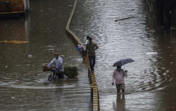 These pictures show how the heavy rains disrupted normal life in several parts of India