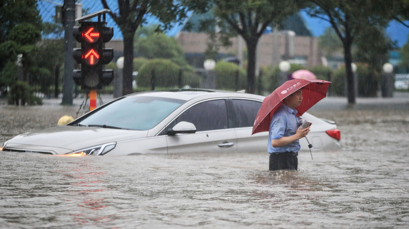 In pics Heavy rains swamp Chinese capital after 1,000 years