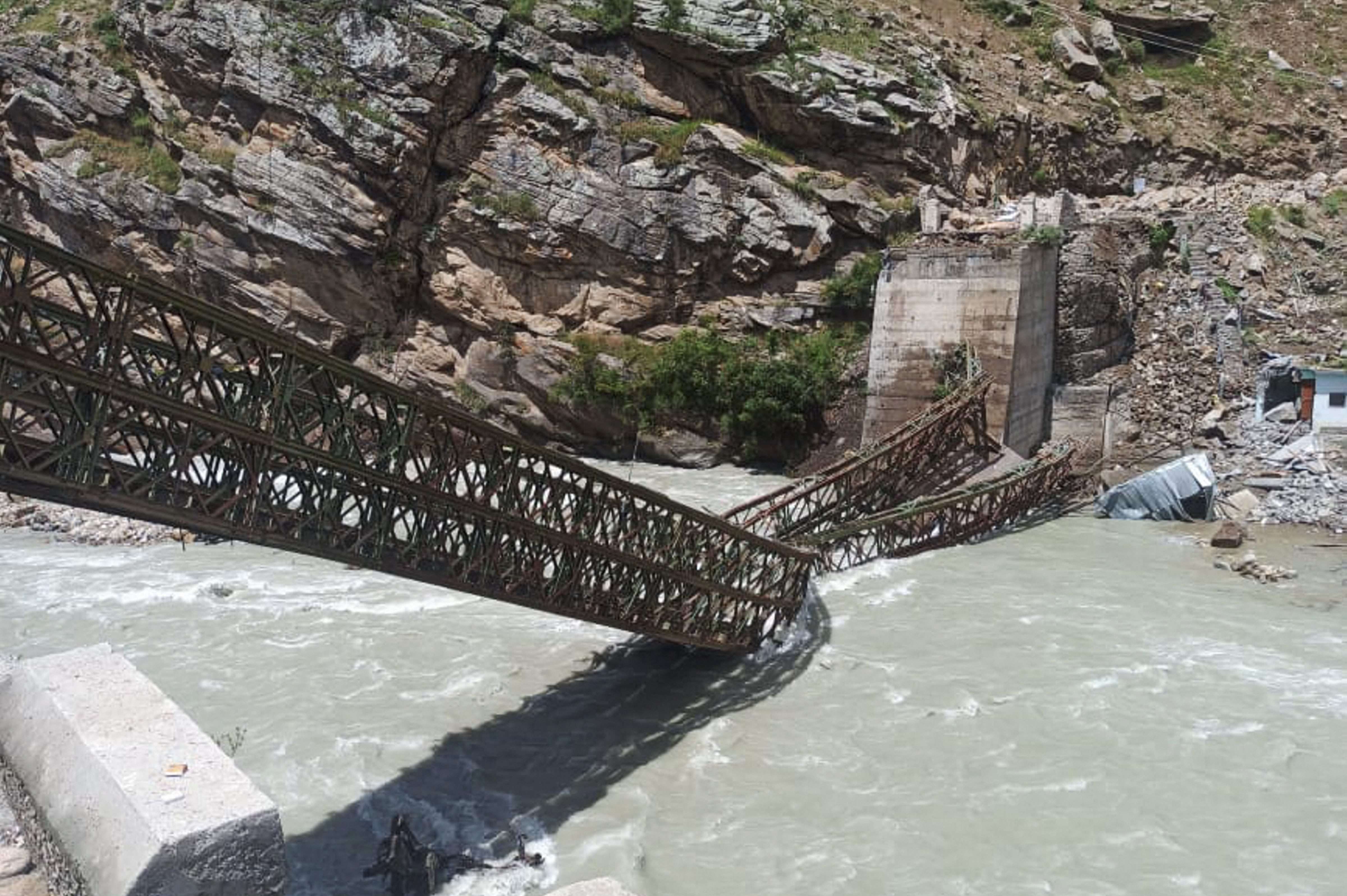 Rolling boulders, severed bridge: Photos of Himachal landslide