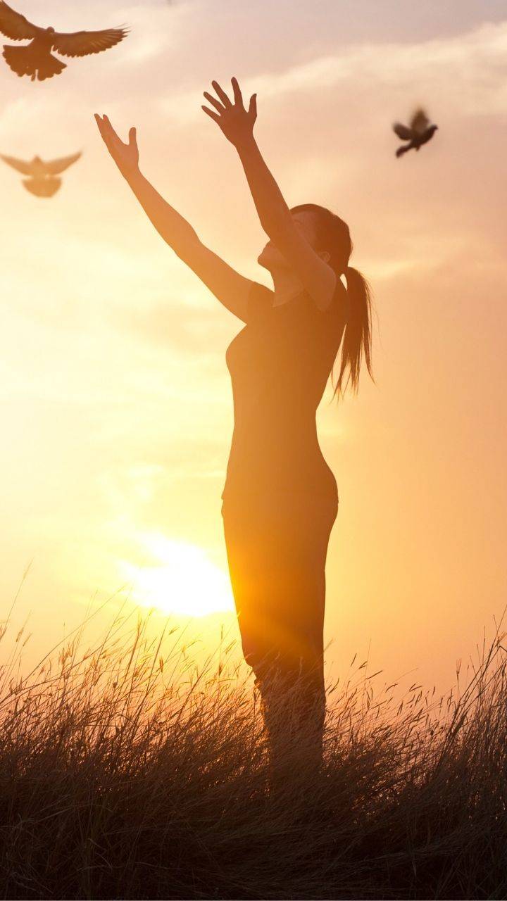 Silhouette of a woman enjoying herself in nature