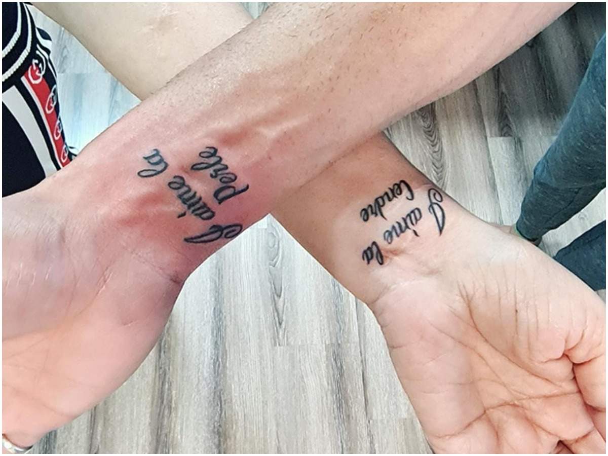 Pearl and Ashish get each other's names inked