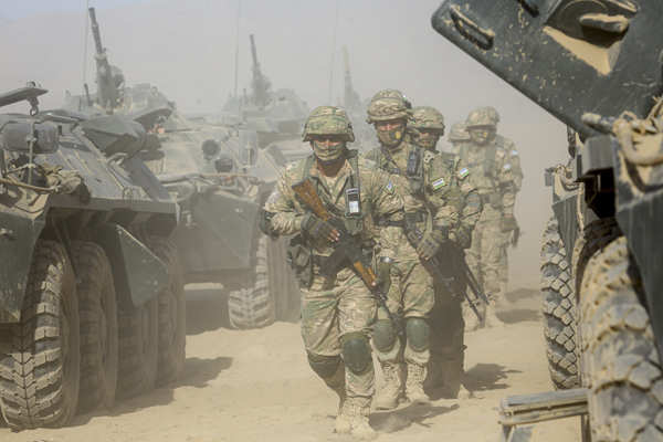 An Uzbek Service Member Drives An Armoured Vehicle During Joint ...