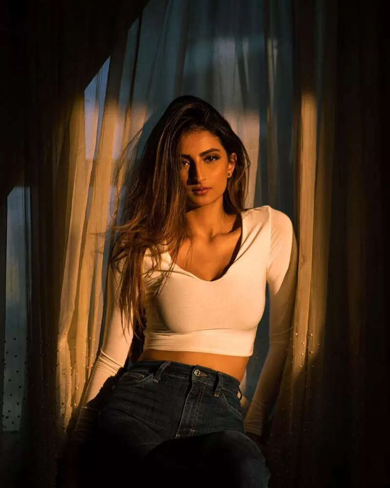 Palak Tiwari shares sun-kissed pictures in purple crop top and printed pants