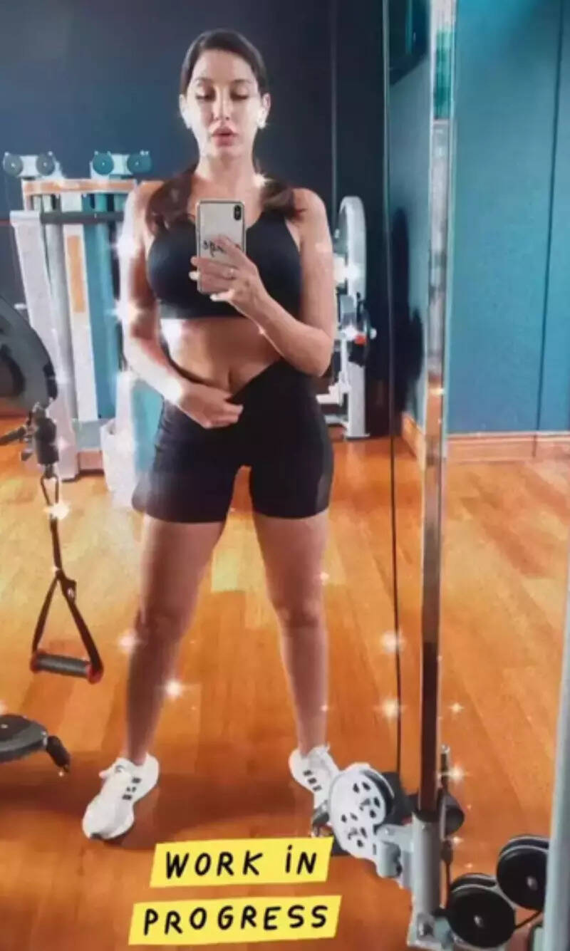 Nora Fatehi flaunts her washboard-abs in sports bra and shorts as she sweats it out in style