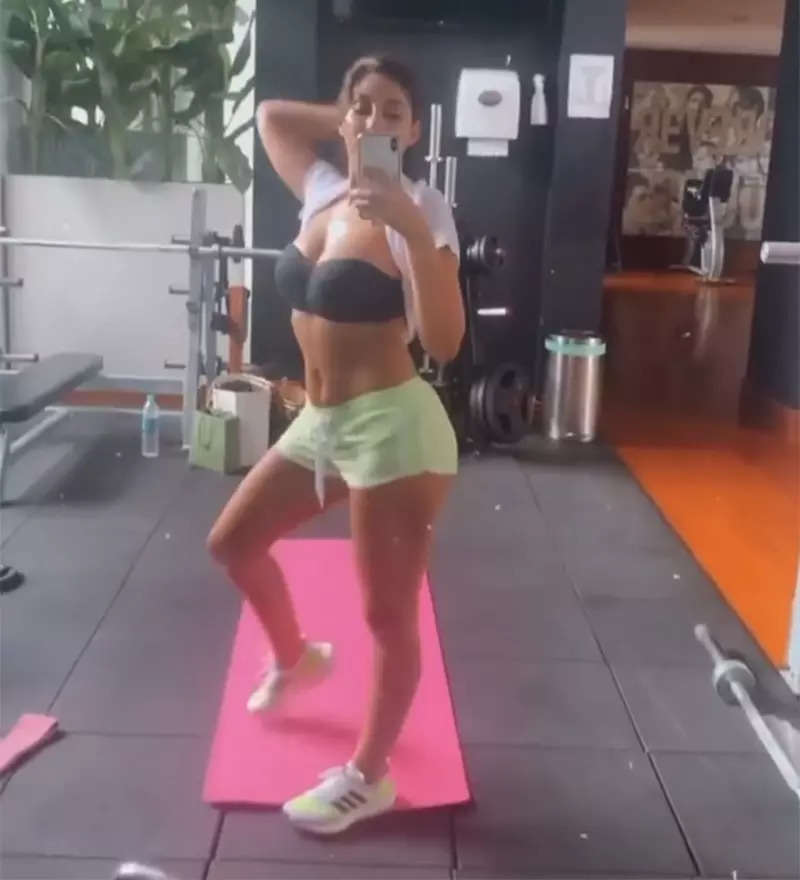 Nora Fatehi flaunts her washboard-abs in sports bra and shorts as she sweats it out in style