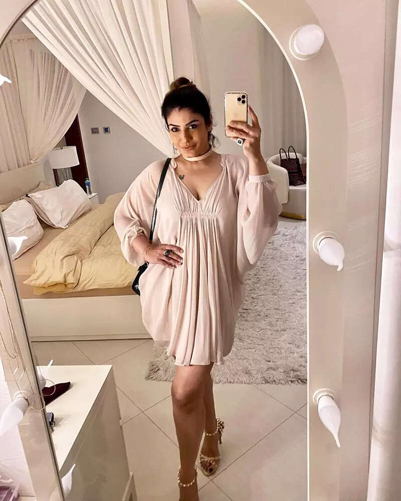 These stunning pictures of Raveena Tandon in a short dress prove she is aging backless