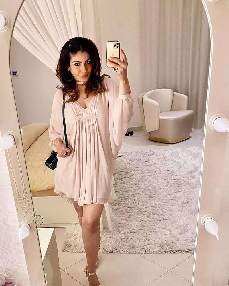 These stunning pictures of Raveena Tandon in a short dress prove she is aging backless