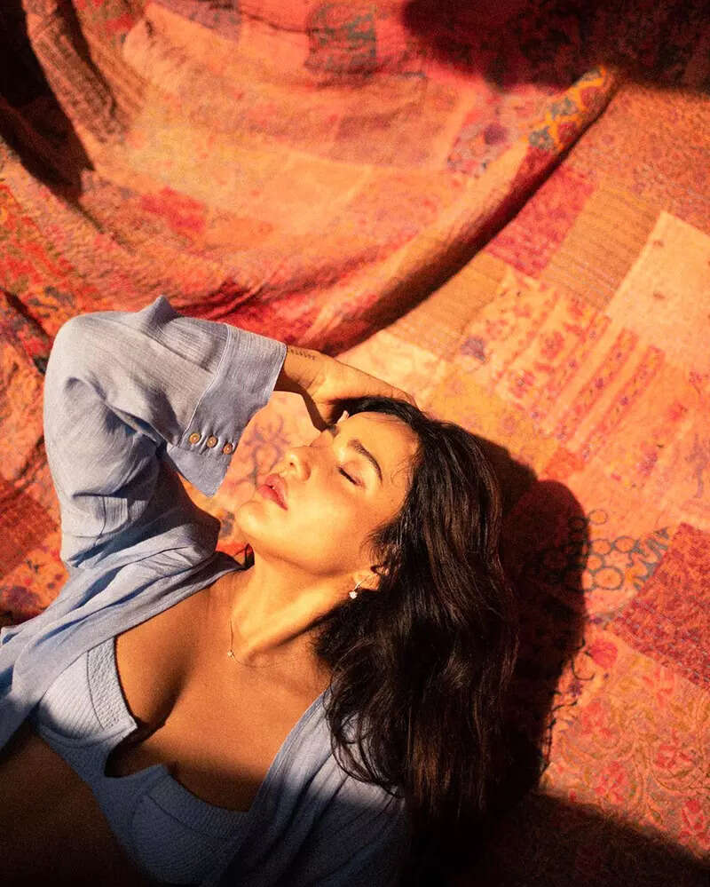 Neha Sharma oozes oomph in a blue bralette and an unbuttoned shirt in these new drool-worthy pictures