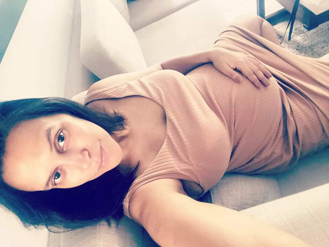 Mommy-to-be Neha Dhupia flaunts her baby bump in these new pictures in a fitted dress