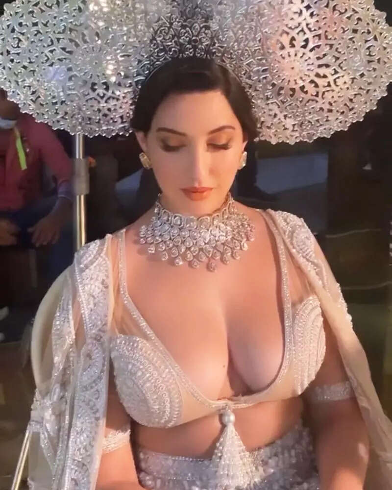 New pictures of Nora Fatehi in a thigh-high slit lehenga with a plunging neckline bralette prove she is effortlessly glamorous