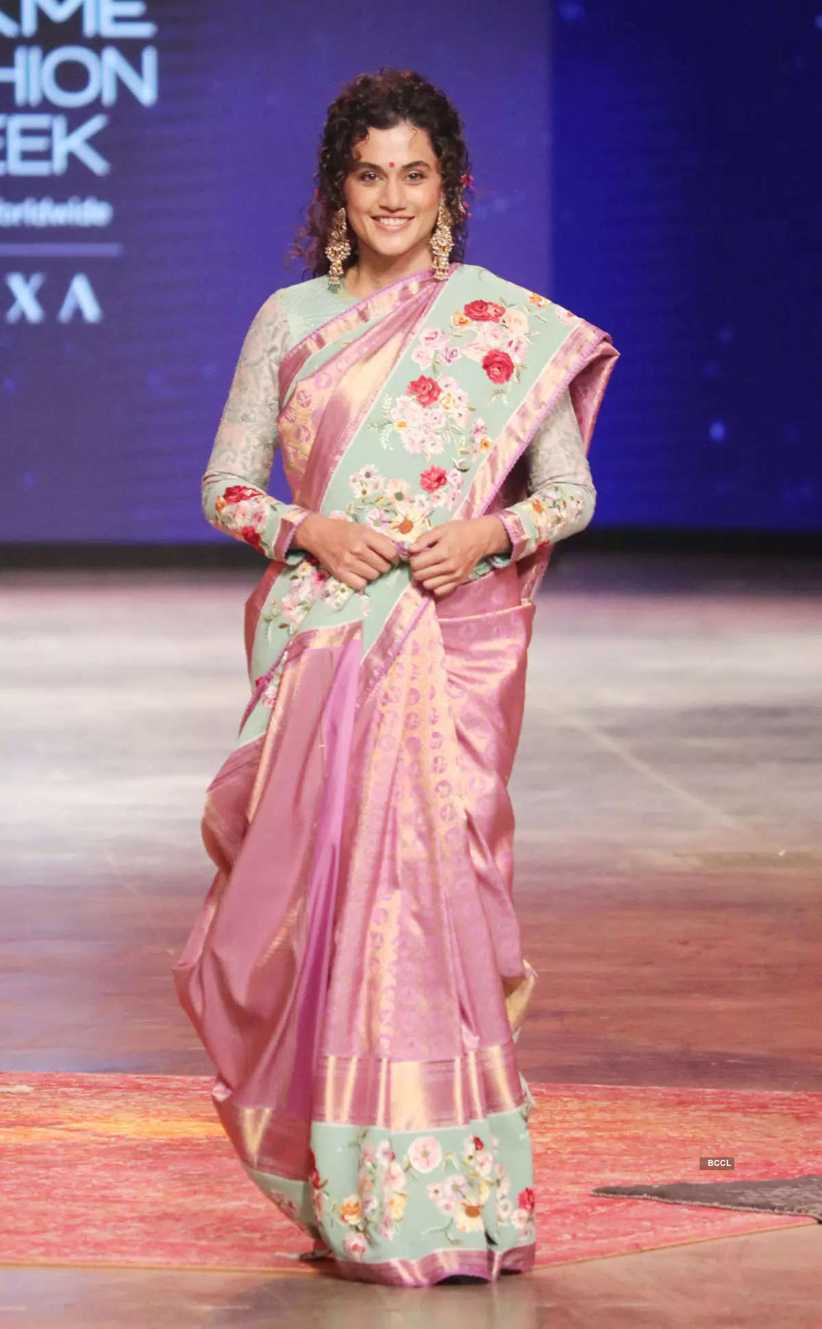 Bollywood celebrities showcase designer outfits at a fashion show