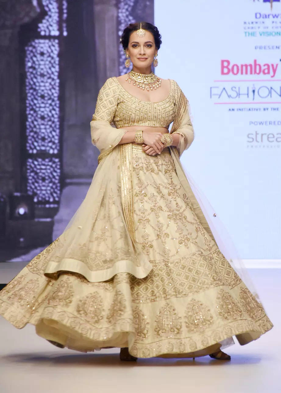 Dia Mirza stuns in a golden lehenga as she walks for Sanjev Marwaaha -  Times of India