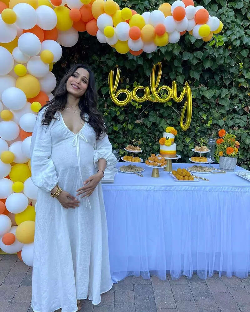 Mommy-to-be Freida Pinto flaunts her baby bump in her latest swimsuit pictures