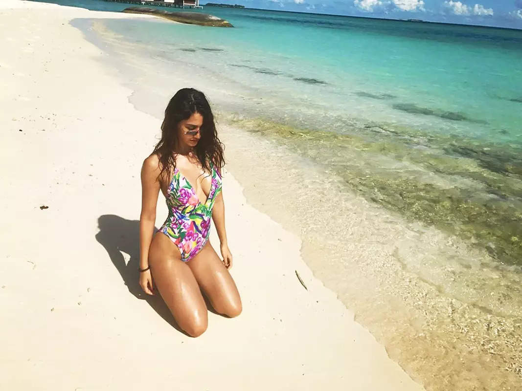 From bikinis to stylish bralettes, 's vacation pictures prove she is a perfect beach beauty