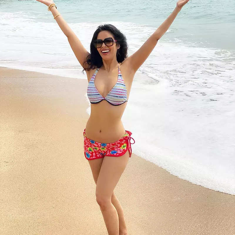 Mallika Sherawat flaunts her toned body in a yellow bikini in these new pictures; fans can’t stop drooling