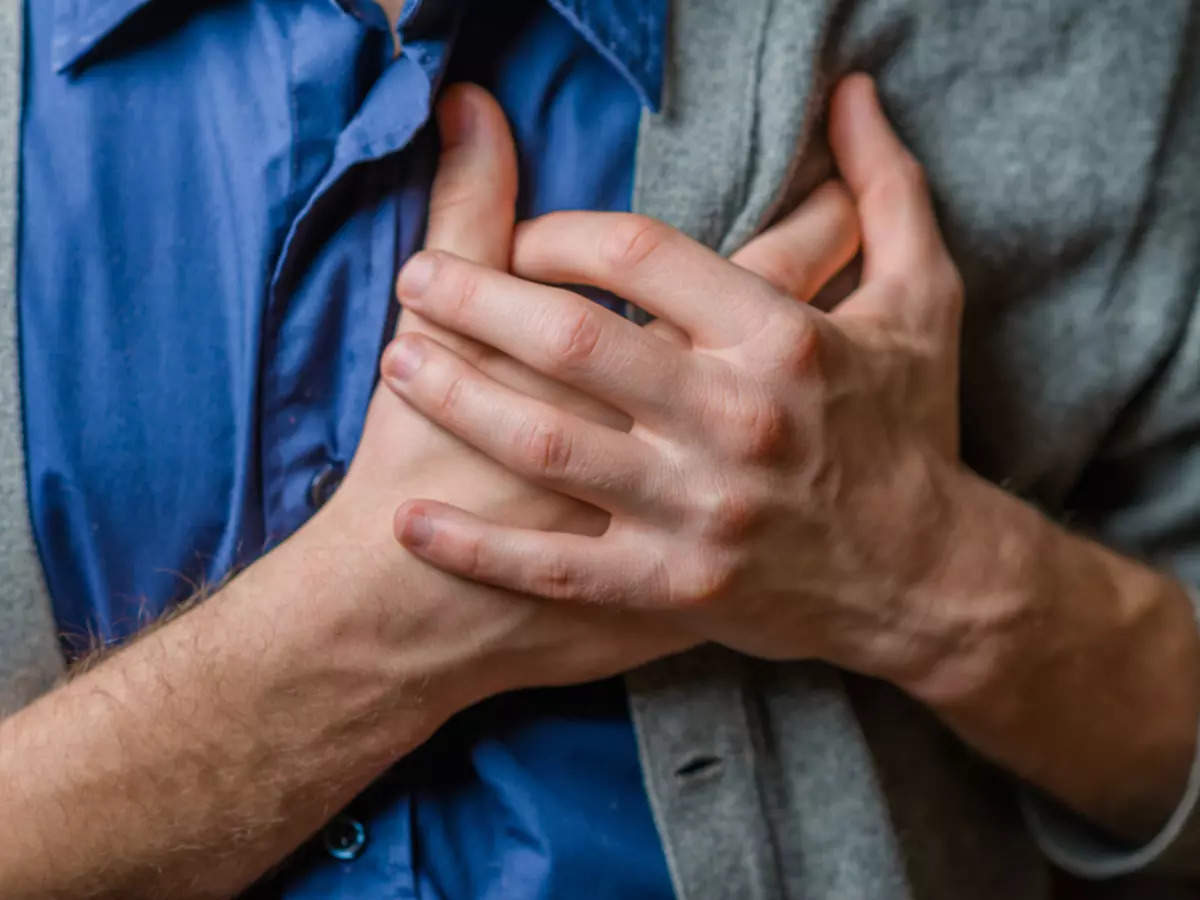 Man feels heartache suffering from cardio ailments and clutching