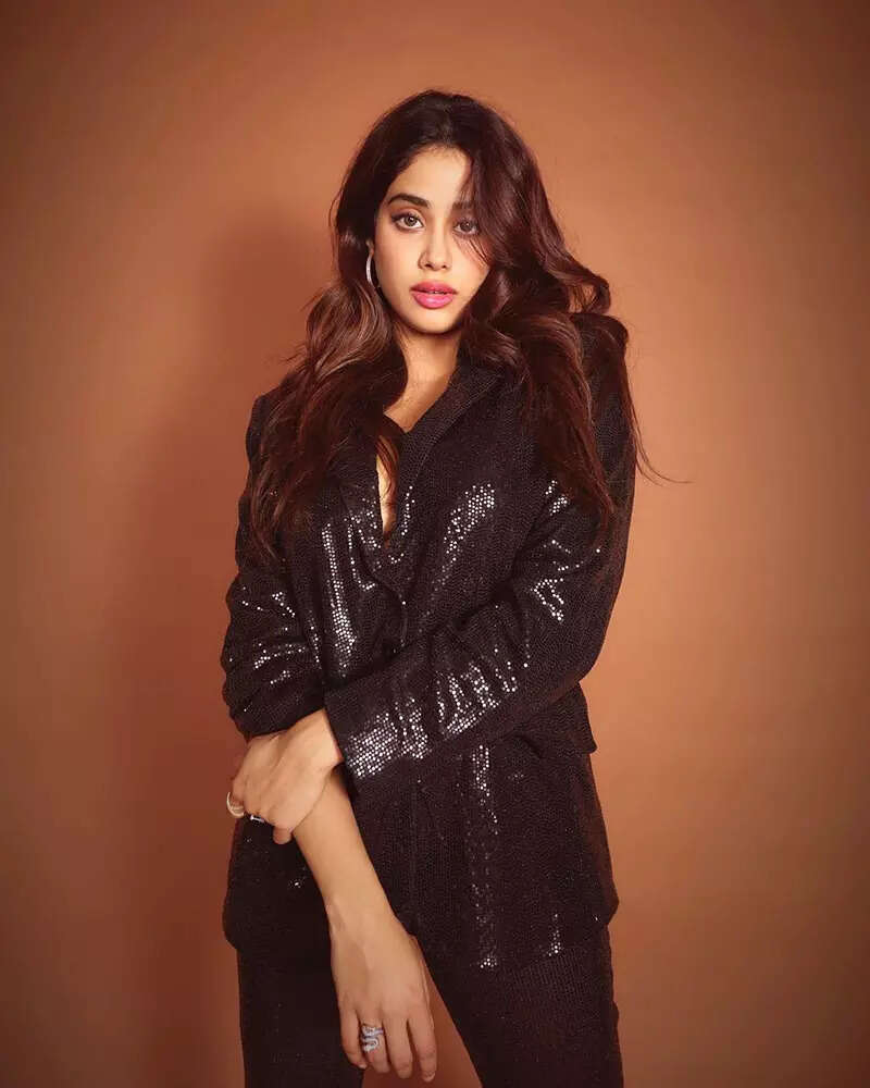 These jaw-dropping pictures from Janhvi Kapoor&rsquo;s new photoshoot in a shimmery black pant-suit with plunging neckline