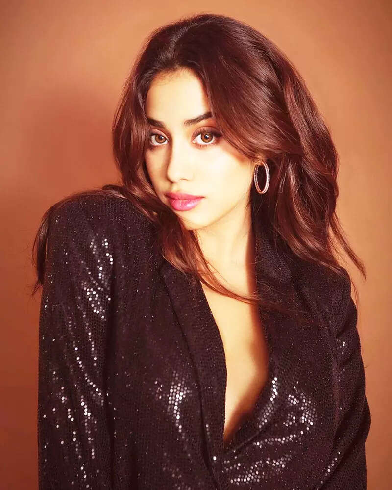 These jaw-dropping pictures from Janhvi Kapoor&rsquo;s new photoshoot in a shimmery black pant-suit with plunging neckline