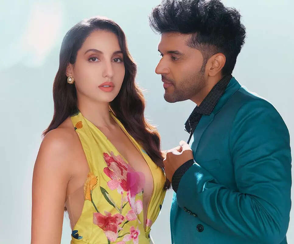 These viral pictures of Nora Fatehi and Guru Randhawa enjoying beach walk spark dating rumours