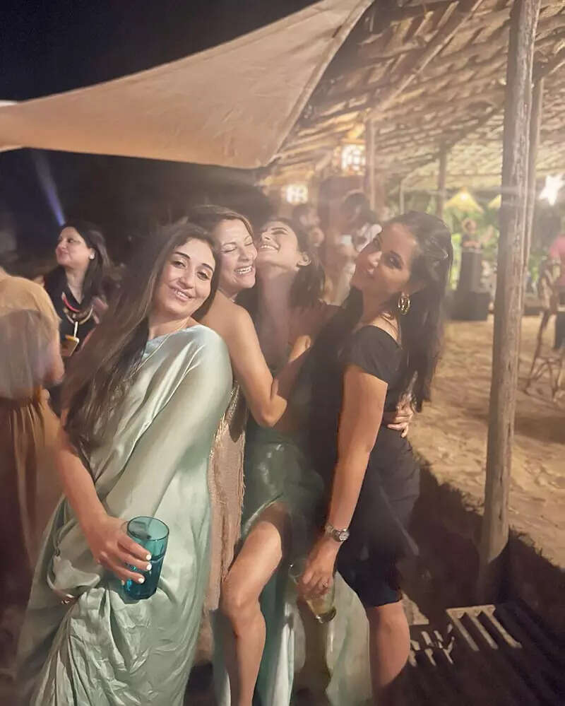 Mouni Roy is making heads turn in an aqua blue bikini top and a thigh-high slit skirt in these new beach vacation pictures