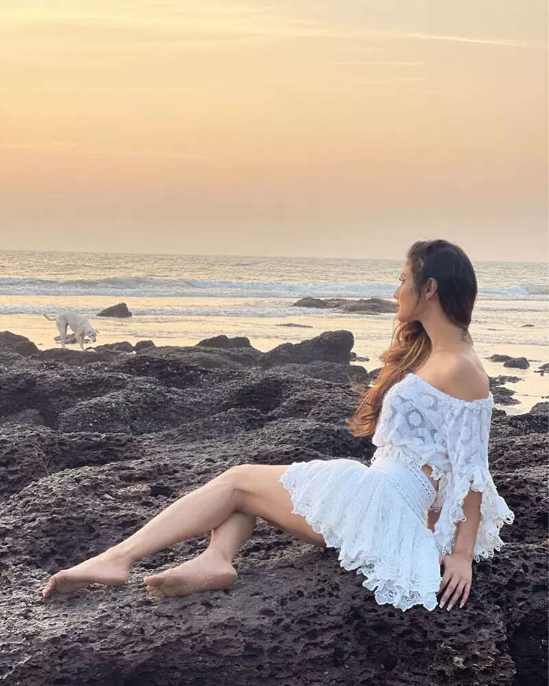 These breathtaking pictures of Mouni Roy in an off-shoulder crop top and short skirt will make you crave for seaside vacation