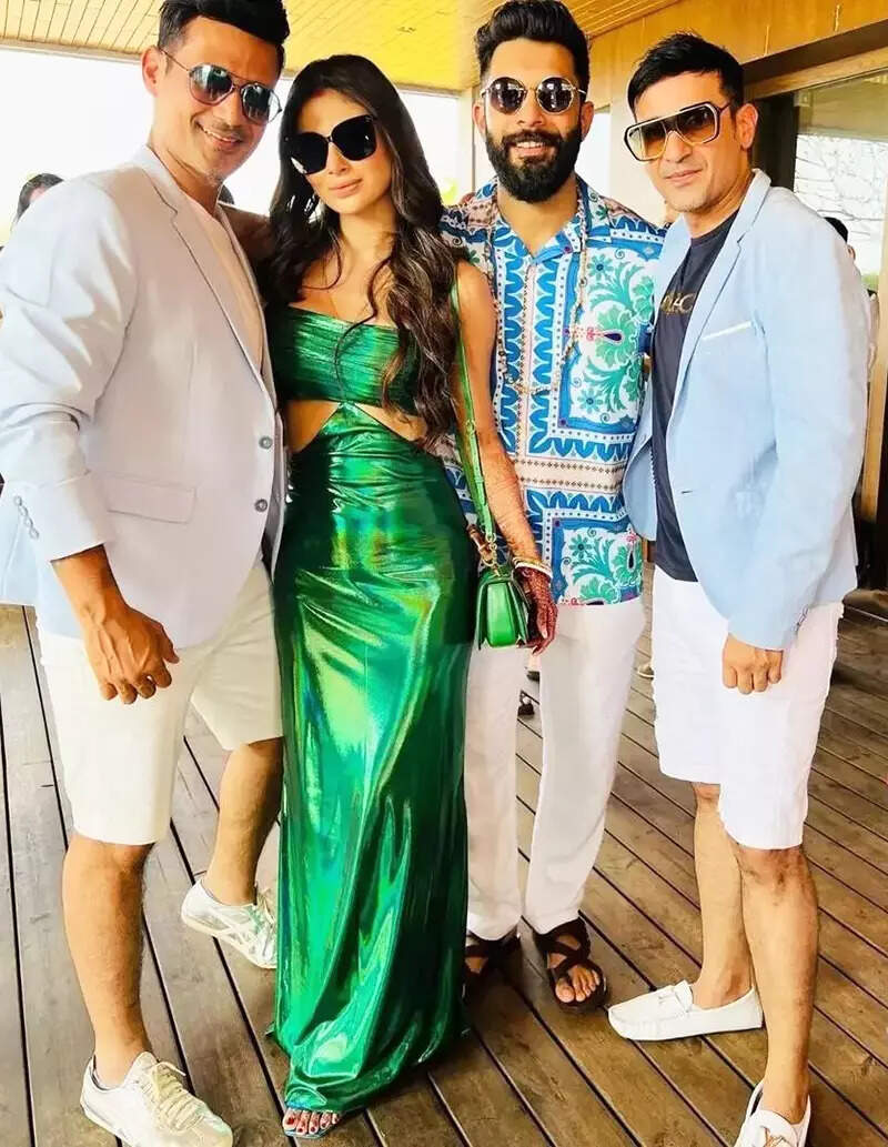 These fun-filled pictures of newlyweds Mouni Roy and Suraj Nambiar from their pool party are simply unmissable