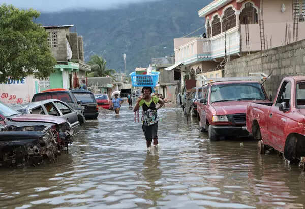 Floods displace thousands in Haiti; see pics