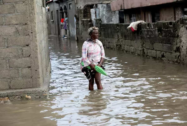 Floods displace thousands in Haiti; see pics
