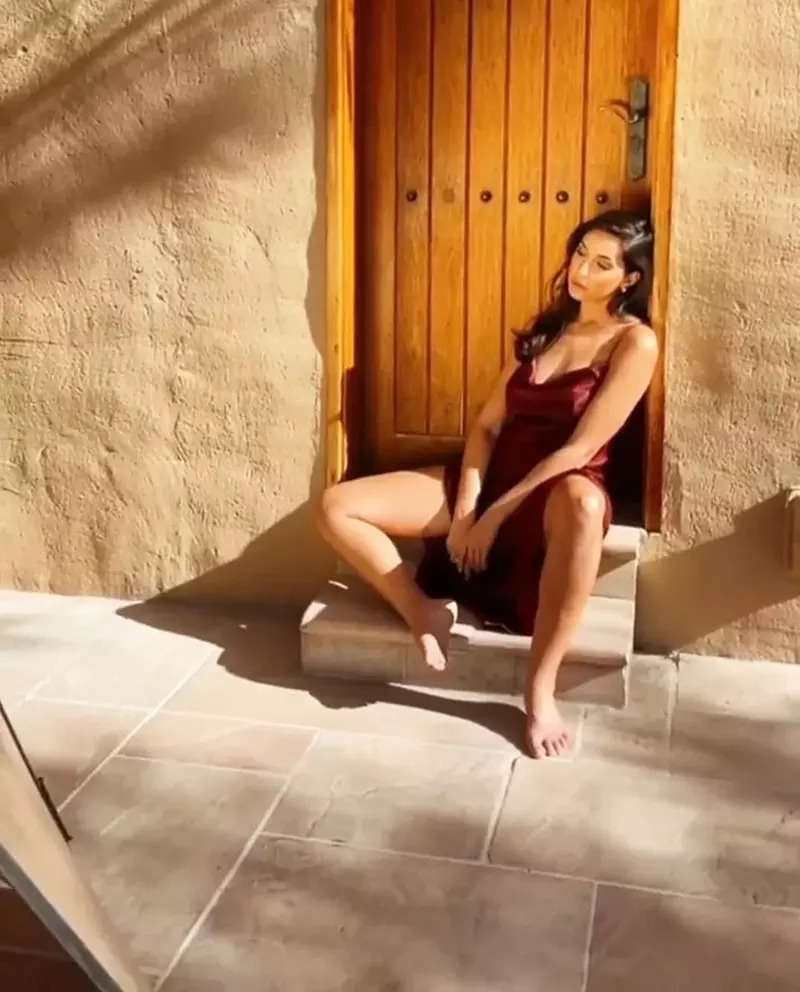Nora Fatehi sets hearts racing with her captivating pictures in thigh-high slit strappy dress