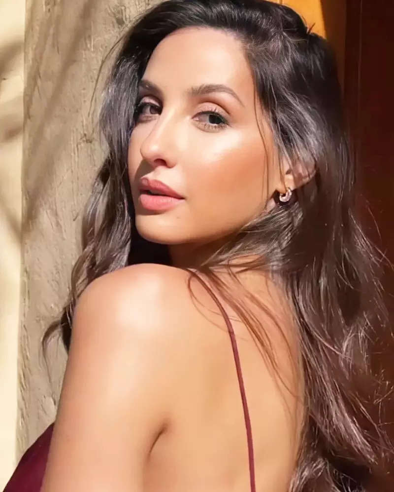Nora Fatehi sets hearts racing with her captivating pictures in thigh-high slit strappy dress
